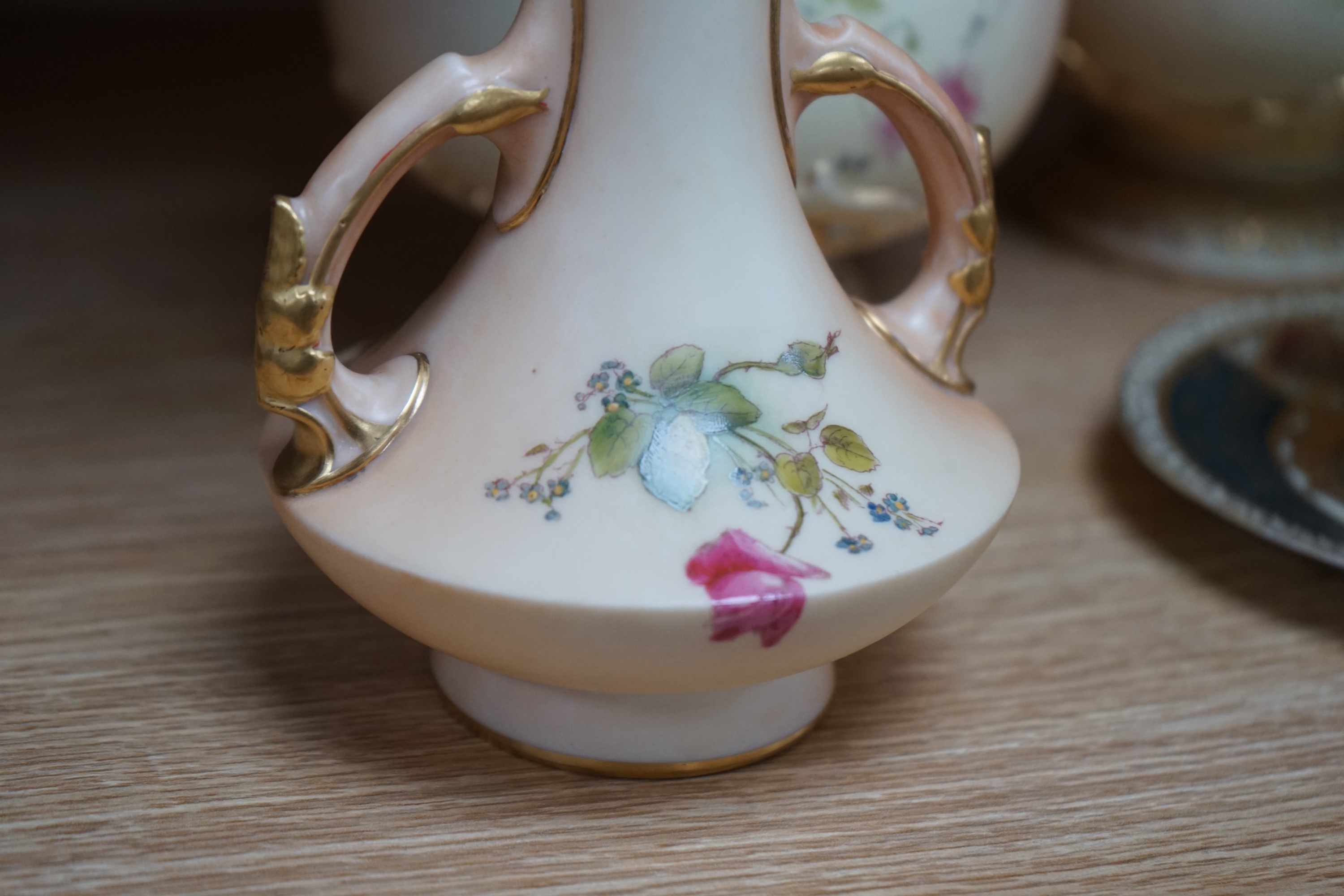 Two pairs of Royal Worcester blush ivory vases, model numbers 2332 and 1626 and Vienna type coffee can with saucer, tallest 22cm. Condition - good